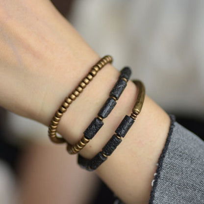 Pulsera multicapa con cuentas de cobre y roca volcánica vintage de Buddha Stones