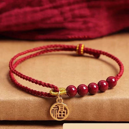 Pulsera trenzada hecha a mano con cuentas de cinabrio y carácter Fu de Buda con hilo rojo bendecido 