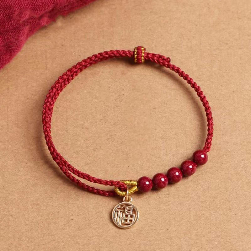 Pulsera trenzada hecha a mano con cuentas de cinabrio y carácter Fu de Buda con hilo rojo bendecido 