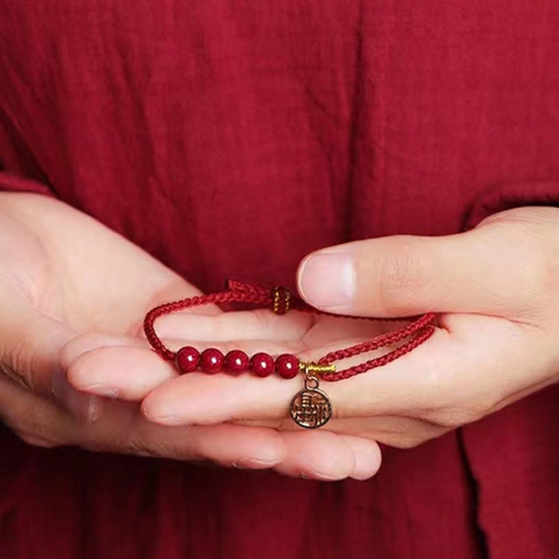 Pulsera trenzada hecha a mano con cuentas de cinabrio y carácter Fu de Buda con hilo rojo bendecido 