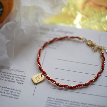 Buddha Stones Rote Schnur Vergoldetes Kupfer Glücks-Stärke-Armband 