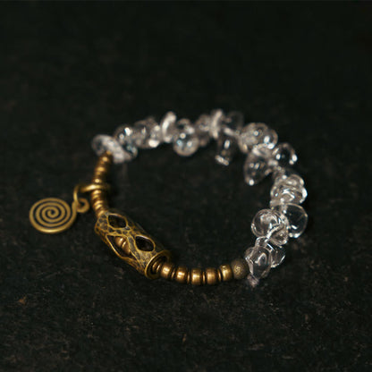 Pulsera de cobre con cristales blancos irregulares y piedras de Buda 