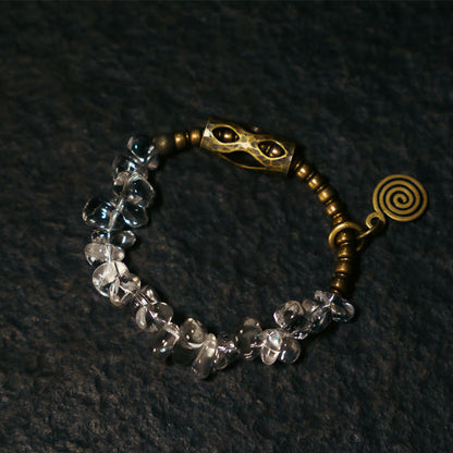 Pulsera de cobre con cristales blancos irregulares y piedras de Buda 