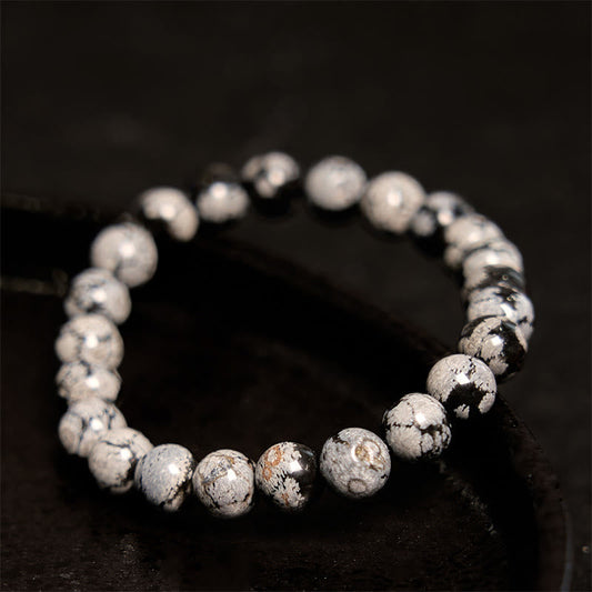 Pulsera de equilibrio de obsidiana y copo de nieve de piedra de Buda