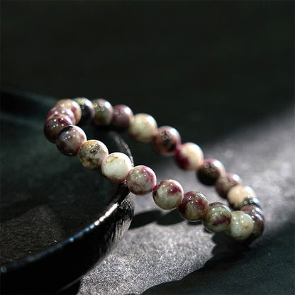 Pulsera de equilibrio de turmalina y flor de ciruelo con piedra de Buda
