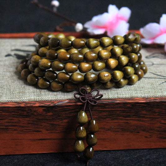 Pulsera de protección de madera natural Phoebe Zhennan con 108 cuentas de lágrima de Buda 