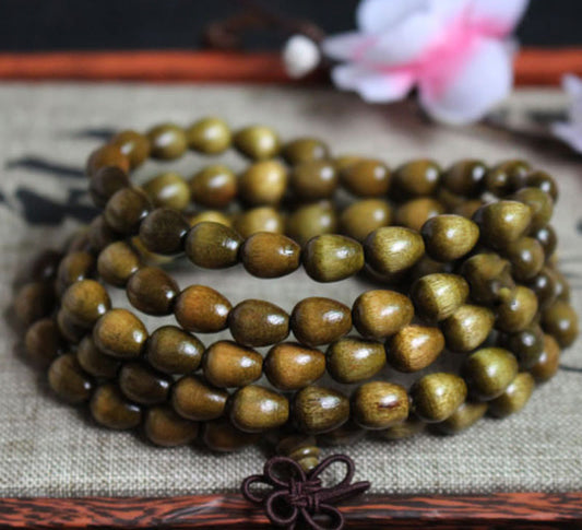 Pulsera de protección de madera natural Phoebe Zhennan con 108 cuentas de lágrima de Buda 