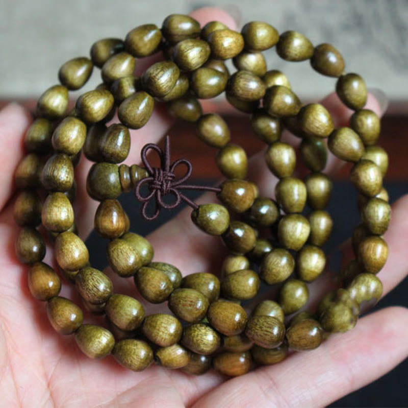 Pulsera de protección de madera natural Phoebe Zhennan con 108 cuentas de lágrima de Buda 