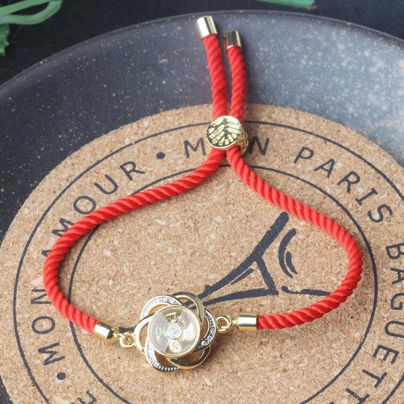 Pulsera trenzada con piedras de Buda giratorias de hilo rojo ciruela, cobre y latón, con protección Qi y Feng Sheng Shui. 