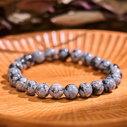 Pulsera de equilibrio de obsidiana y copo de nieve de piedra de Buda