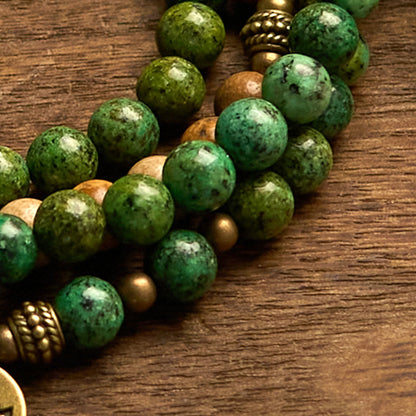 Pulsera con 108 cuentas de mala de Buda, piedra natural, jaspe, turquesa y loto. 