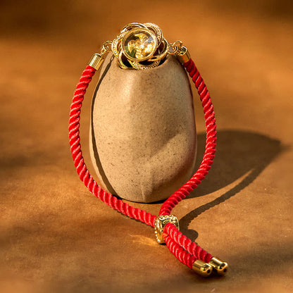 Pulsera trenzada con piedras de Buda giratorias de hilo rojo ciruela, cobre y latón, con protección Qi y Feng Sheng Shui. 
