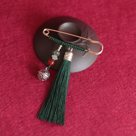 Broche con borlas de campana retro de piedras de Buda
