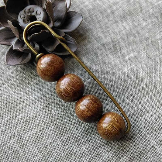 Broche curativo con cuentas de peltogyne, agathis alba, sándalo y madera de ébano de Buda