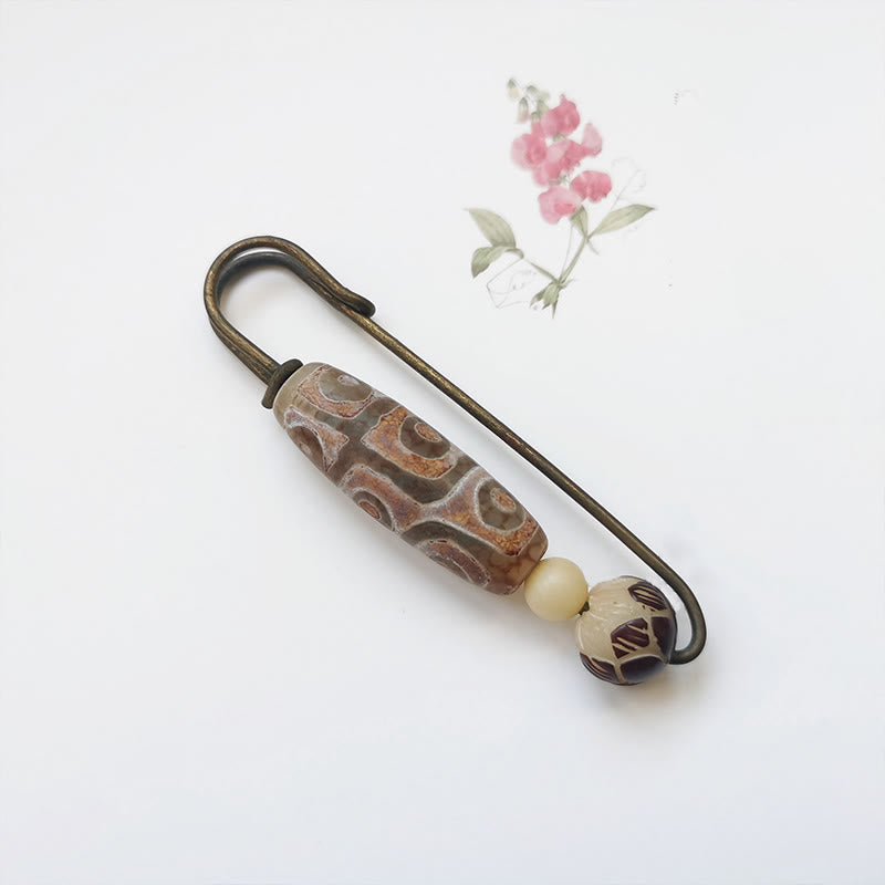 Broche protector de loto con semillas de bodhi y cuentas Dzi de nueve ojos de Buda