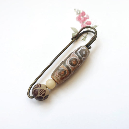 Broche protector de loto con semillas de bodhi y cuentas Dzi de nueve ojos de Buda