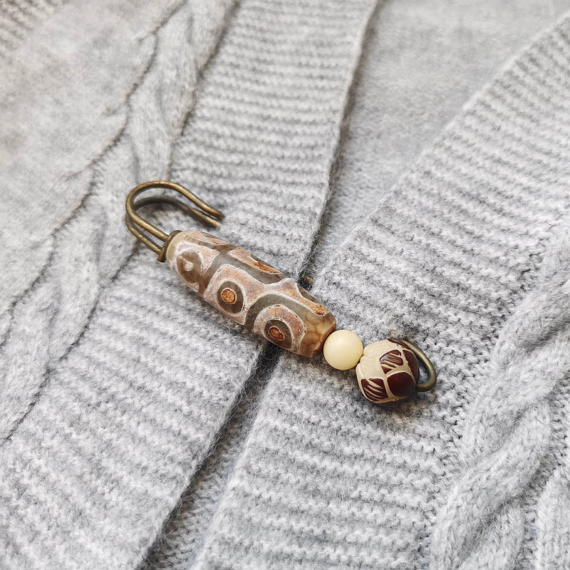 Broche protector de loto con semillas de bodhi y cuentas Dzi de nueve ojos de Buda