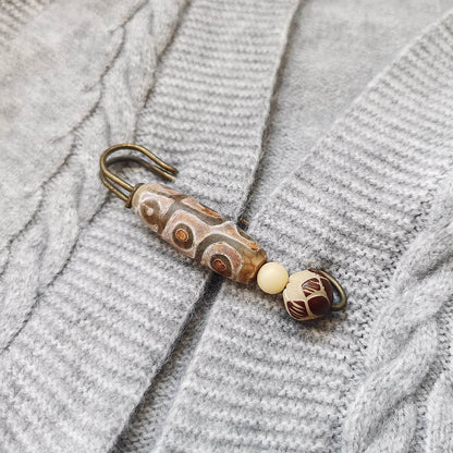 Broche protector de loto con semillas de bodhi y cuentas Dzi de nueve ojos de Buda