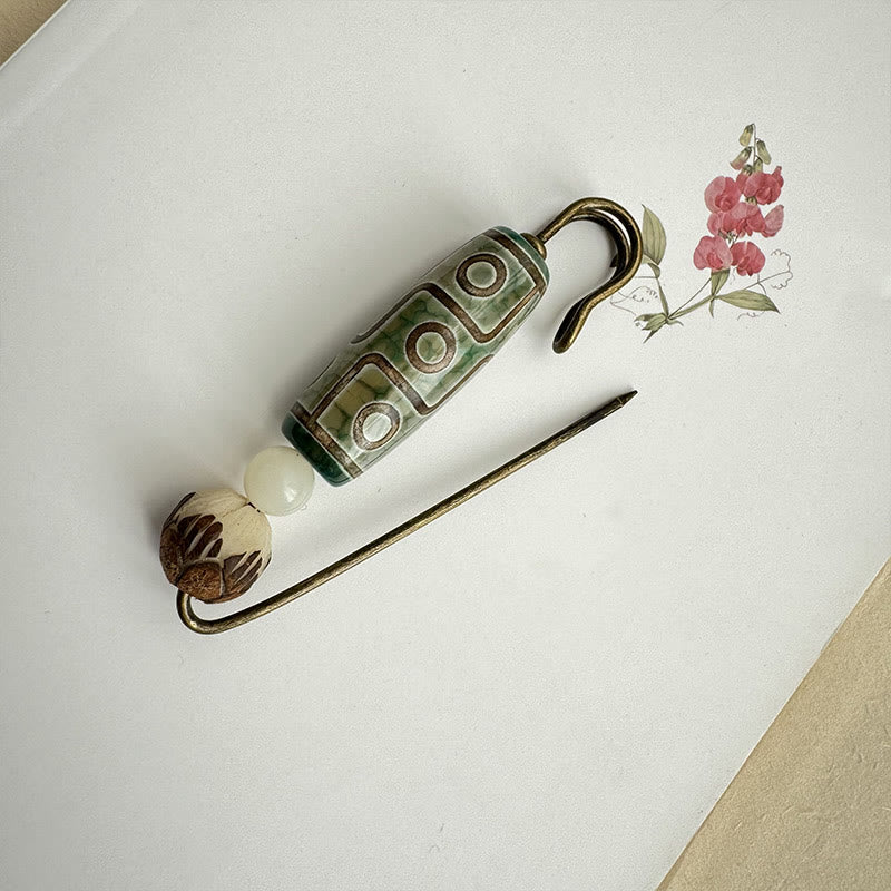 Broche protector de loto con semillas de bodhi y cuentas Dzi de nueve ojos de Buda