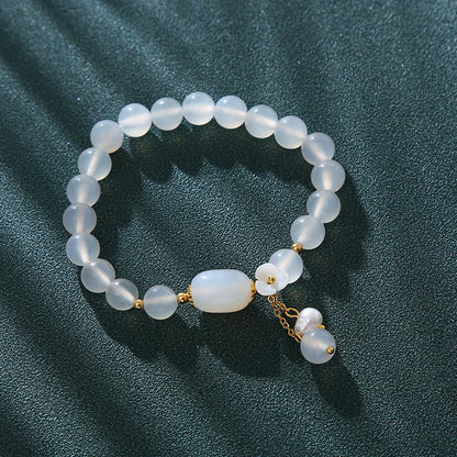 Pulsera de la suerte con flor de perla y ágata blanca de Buddha Stones