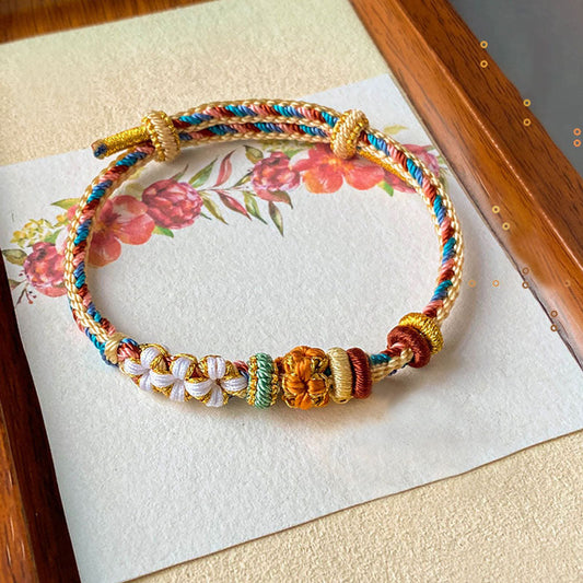 Pulsera trenzada con diseño de flor de melocotón y color Dunhuang hecha a mano con piedras de Buda