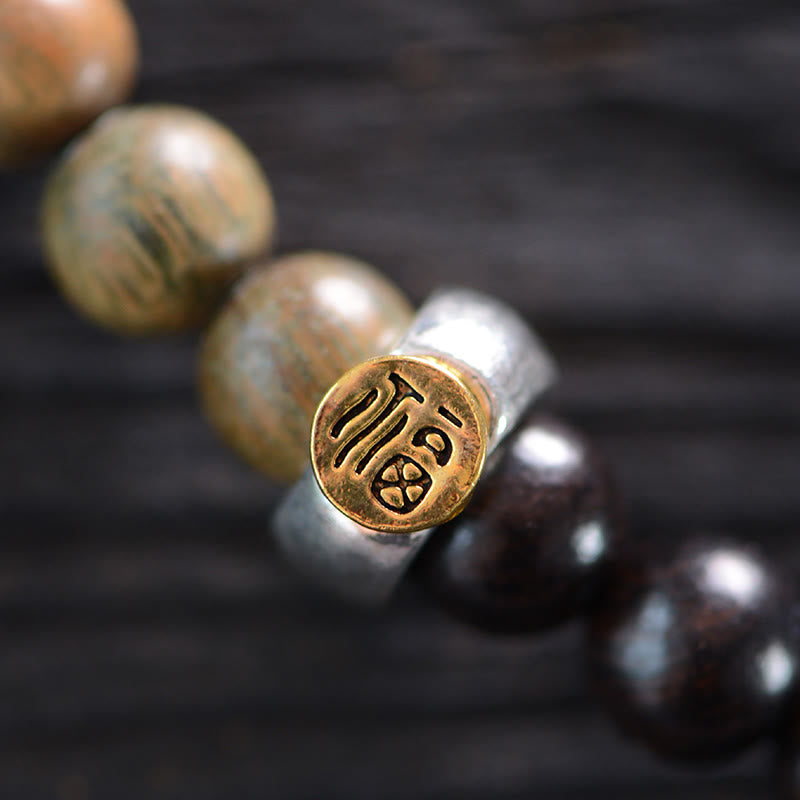 Pulsera de doble vuelta con cuentas Dzi de tres ojos de madera de ébano y sándalo verde tibetano con piedras de Buda y carácter Fu, equilibrio y paz.