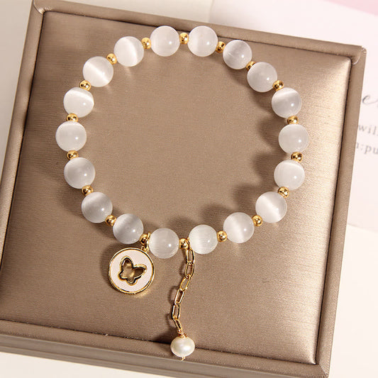 Pulsera de amor con dije de mariposa y ojo de gato de piedras de Buda