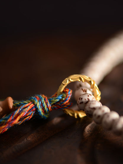 Pulsera Bodhi de Estrella y Luna con Nueve Cuentas Dzi de Hilo Manual