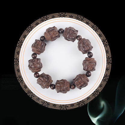 Buddha Stones Adlerholz Buddha geschnitzt Ruhe Armband 