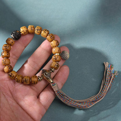 Buddha-Steine, natürliches tibetisches Kamelknochen-Hakenkreuz-Dzi-Perlen-Shankha-Buddha-Charm, Kirtimukha-Glücksschutz-Quastenarmband