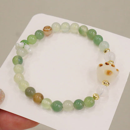 Pulsera de soporte con piedras de Buda, ágata verde, piedra solar, ojo de gato, semilla de Bodhi y pata de gato