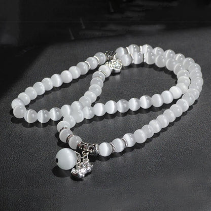 Pulsera triple vuelta con soporte PiXiu de ojo de gato y piedras de Buda