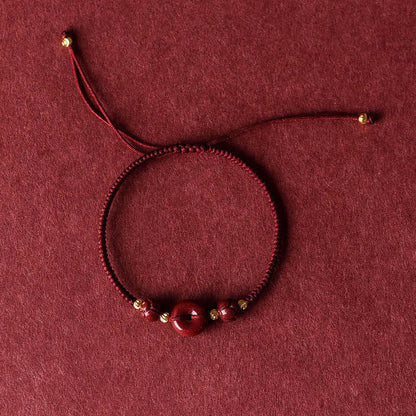 Pulsera trenzada con bendición de paz y cinabrio de loto hecha a mano con piedras de Buda