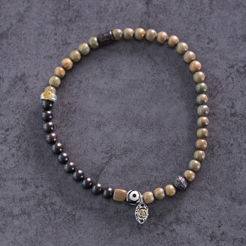 Pulsera de doble vuelta con cuentas Dzi de tres ojos de madera de ébano y sándalo verde tibetano con piedras de Buda y carácter Fu, equilibrio y paz.