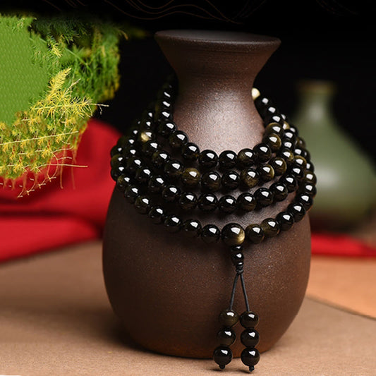 Pulsera de obsidiana con 108 cuentas de mala de Buda y brillo dorado natural