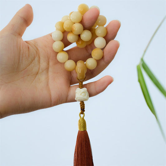 Mala de muñeca con borla de armonía y amuleto de león danzante de marfil con semillas de bodhi naturales de Buda
