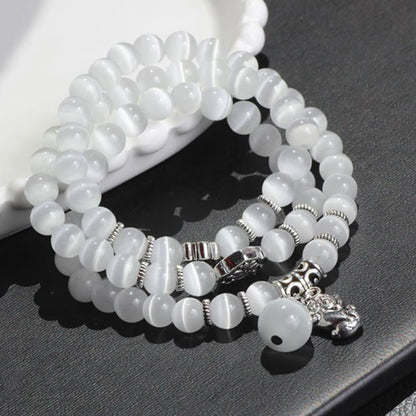 Pulsera triple vuelta con soporte PiXiu de ojo de gato y piedras de Buda