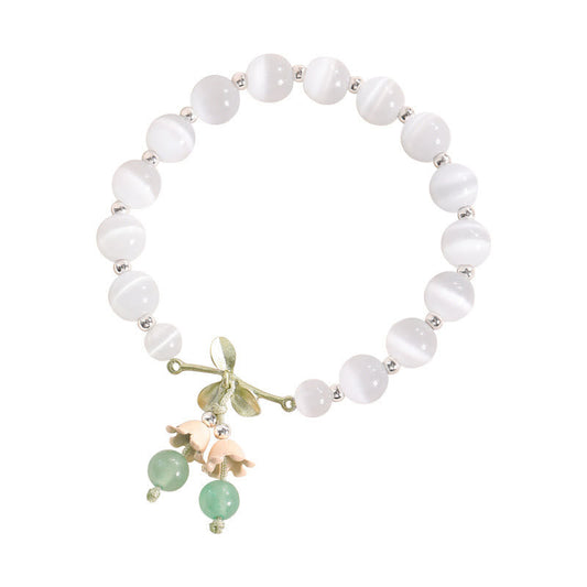 Pulsera con dijes de orquídea de la paz, calcedonia azul, aventurina verde y ojo de gato de Buda