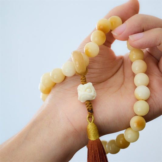 Mala de muñeca con borla de armonía y amuleto de león danzante de marfil con semillas de bodhi naturales de Buda