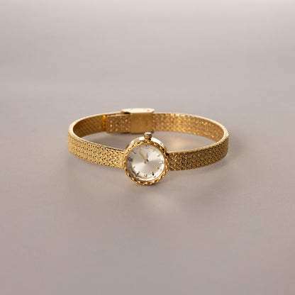 Reloj redondo trenzado