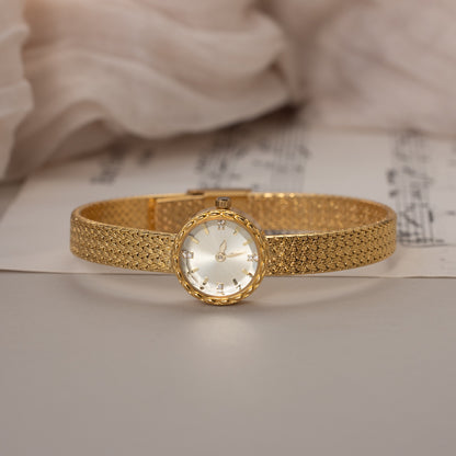 Reloj redondo trenzado