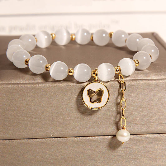 Pulsera de amor con dije de mariposa y ojo de gato de piedras de Buda