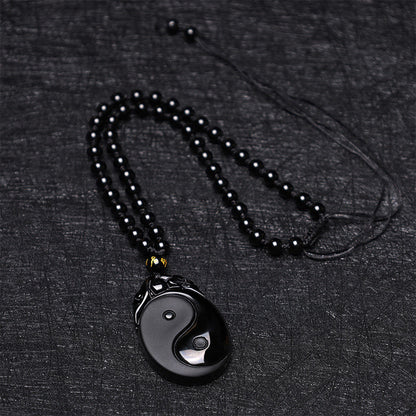 Collar con colgante de obsidiana negra natural con piedras de Buda que simboliza la fuerza y ​​el cumplimiento del Yin Yang. 