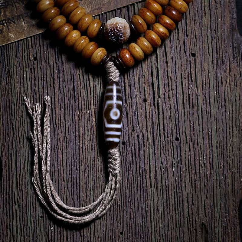 Pulsera tibetana de 108 cuentas Mala de hueso de yak con tres ojos de Dzi y piedras de Buda para alejar los malos espíritus.