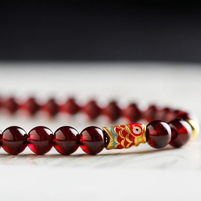 Buddha Stones 999 Gold Koi Fisch Natur Granat Schutzarmband