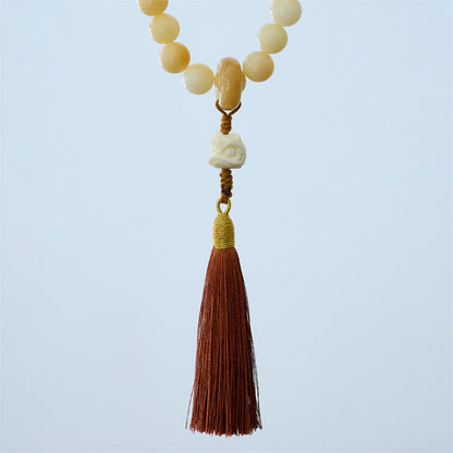 Mala de muñeca con borla de armonía y amuleto de león danzante de marfil con semillas de bodhi naturales de Buda