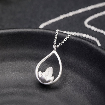 Collar con colgante de flor de loto y flor de loto de plata de ley 925 con piedras de Buda y diseño floral.