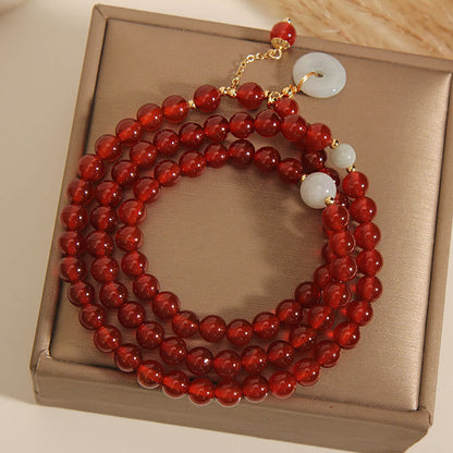 Pulsera de triple vuelta con hebilla de paz y jade de ágata roja natural de Buddha Stones 