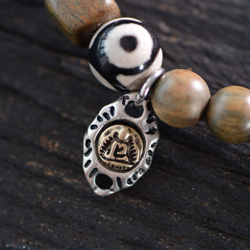 Pulsera de doble vuelta con cuentas Dzi de tres ojos de madera de ébano y sándalo verde tibetano con piedras de Buda y carácter Fu, equilibrio y paz.