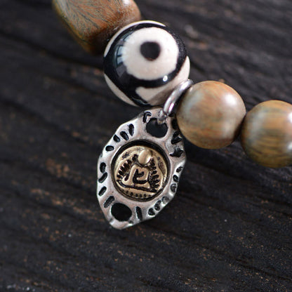 Pulsera de doble vuelta con cuentas Dzi de tres ojos de madera de ébano y sándalo verde tibetano con piedras de Buda y carácter Fu, equilibrio y paz.